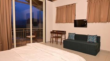 Deluxe Room, Balcony, Garden View | Desk, laptop workspace, free WiFi
