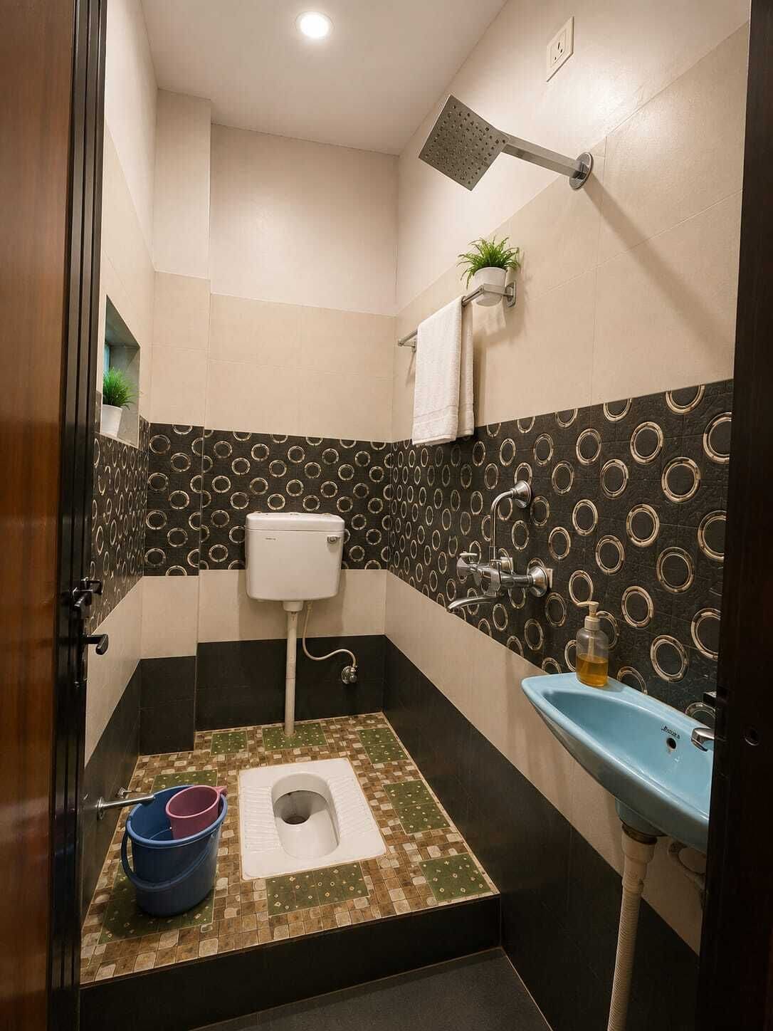 A compact bathroom with a toilet, bidet, and sink.