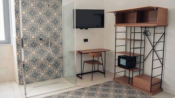 Habitación Deluxe (Sciara) | Caja de seguridad en la habitación, wifi gratis y ropa de cama