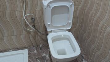 Slippers, towels, soap, toilet paper