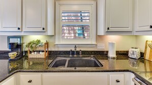 A kitchen with a built-in sink, a coffee maker, and a toaster on the counter. - Walkable 30A Beach House: 2 Community Pools, Bikes (Santa Rosa Beach)