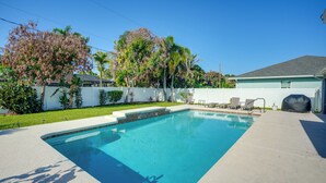 A rectangular swimming pool with a clear blue water surface, surrounded by a concrete deck. - 4 Mi to River & Gardens! Quiet Port St Lucie Home (Port Saint Lucie)