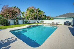 A rectangular swimming pool with a clear blue water surface, surrounded by a concrete deck. - 4 Mi to River & Gardens! Quiet Port St Lucie Home (Port Saint Lucie)