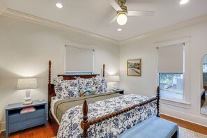 A bedroom with a large bed, a nightstand, a ceiling fan, and two windows. - 1 Mi to Dtwn Tyler! Historic Retreat + Guest Suite (Tyler)
