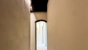 A hallway with a door at the end, leading to a bright room. - Bella Vigna (Florence)