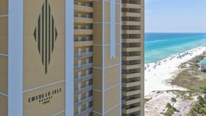 A high-rise hotel with a view of a beach. - Emerald Isle 1905 - JUST COMPLETELY RENOVATED! Beach chair service included! (Panama City Beach)