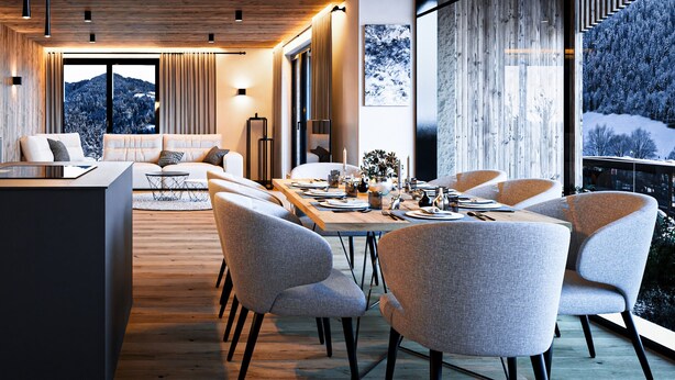 Un espace repas moderne avec une table en bois disposée pour quatre personnes, entourée de chaises à revêtement gris.
