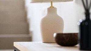 A lamp with a textured shade on a table. - Charming Townhouse in Cancelada Village (Cancelada)