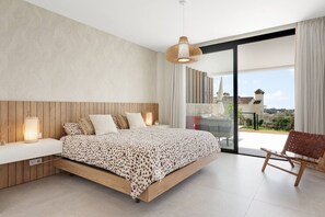 A modern bedroom with a large bed, a bedside table, a hanging light, and a view of the outdoors. - Venere Retreat: Serenity and Design (Marbella)