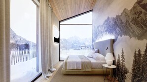 Une chambre avec une grande fenêtre, un lit, une table de chevet et une fresque murale.