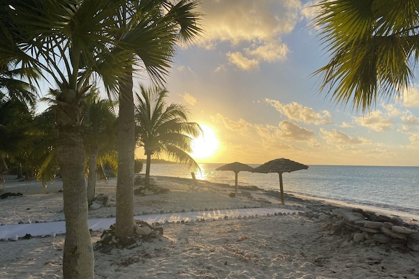 On the beach, sun loungers, beach towels