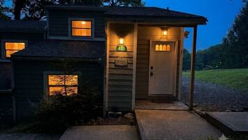 A house with a porch, a door, and a mailbox.