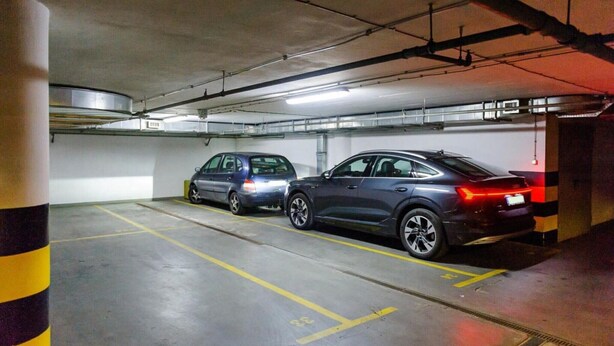 A parking garage with two cars parked in designated spaces. - House in Saint-Pabu near Stunning Beaches (Warszawa 2)