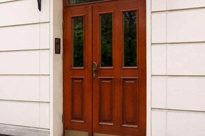 A double wooden door with a glass panel and a keypad lock. - Quiet City Apartment for 4 (Warszawa)