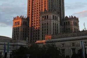 A large, historic building with multiple floors and a prominent central tower. - Modern Romantic CIty Getaway (Warszawa)