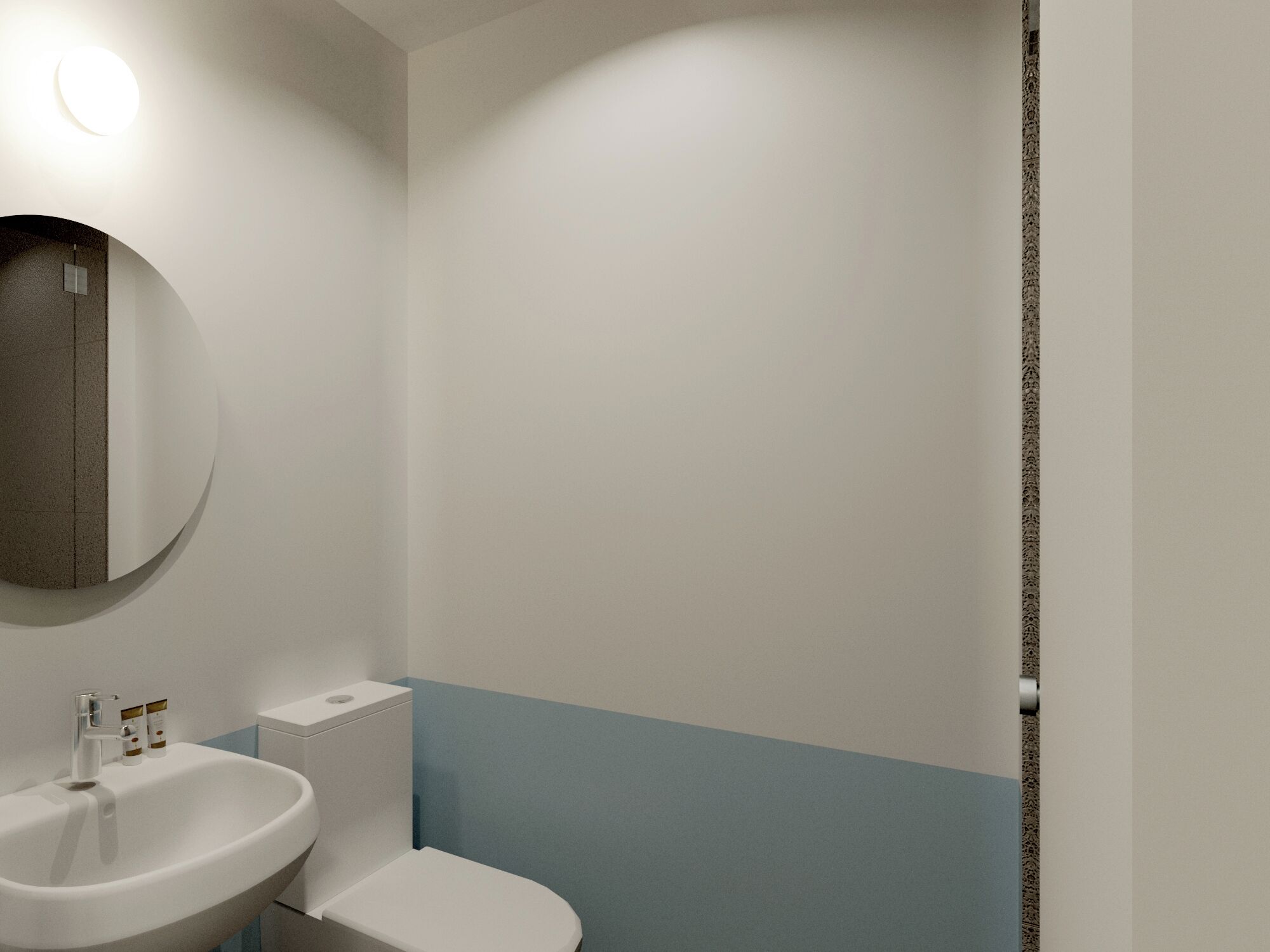 A bathroom with a white sink, a toilet, and a mirror.