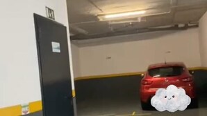 A parking garage with a red car parked in the distance. - Madeira Mar – Seaview – Top-Floor Apartment with Rooftop Pool-Guest Information (Funchal)