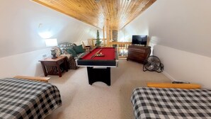 A cozy indoor space with a pool table, seating area, and a television. - Secluded A-Frame Cabin w/ Sauna+Pool Table+ Fire Pit on Petit Jean Mountain (Morrilton)