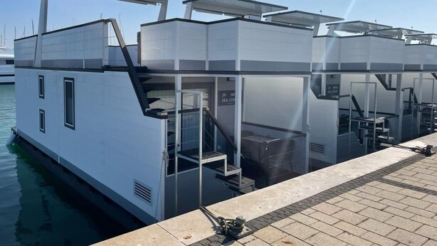 A floating structure with multiple levels, including a lower deck and upper deck, connected by a staircase. - Houseboat With sea View and Whirlpool (Novigrad)