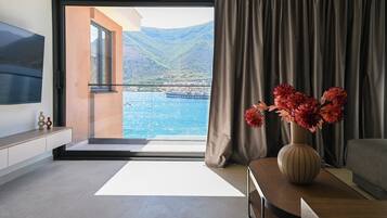 Quadrupla Deluxe, balcone, vista mare | Area soggiorno