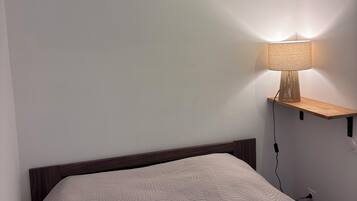 1 bedroom, desk, iron/ironing board, travel crib