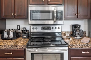 A kitchen with a stainless steel microwave, oven, and toaster. - *Scottsdale Kierland*Pool*Spa*Water Fall* (Scottsdale)