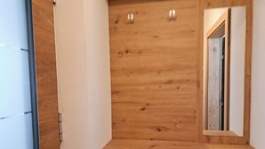 A wooden dresser with a mirror and two drawers. - Apartment Tyrol by Interhome (Auffach)
