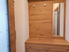 A wooden dresser with a mirror and two drawers. - Apartment Tyrol by Interhome (Auffach)