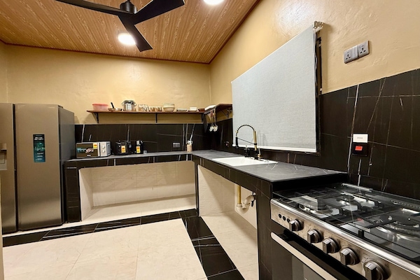 Full-size fridge, microwave, stovetop, rice cooker
