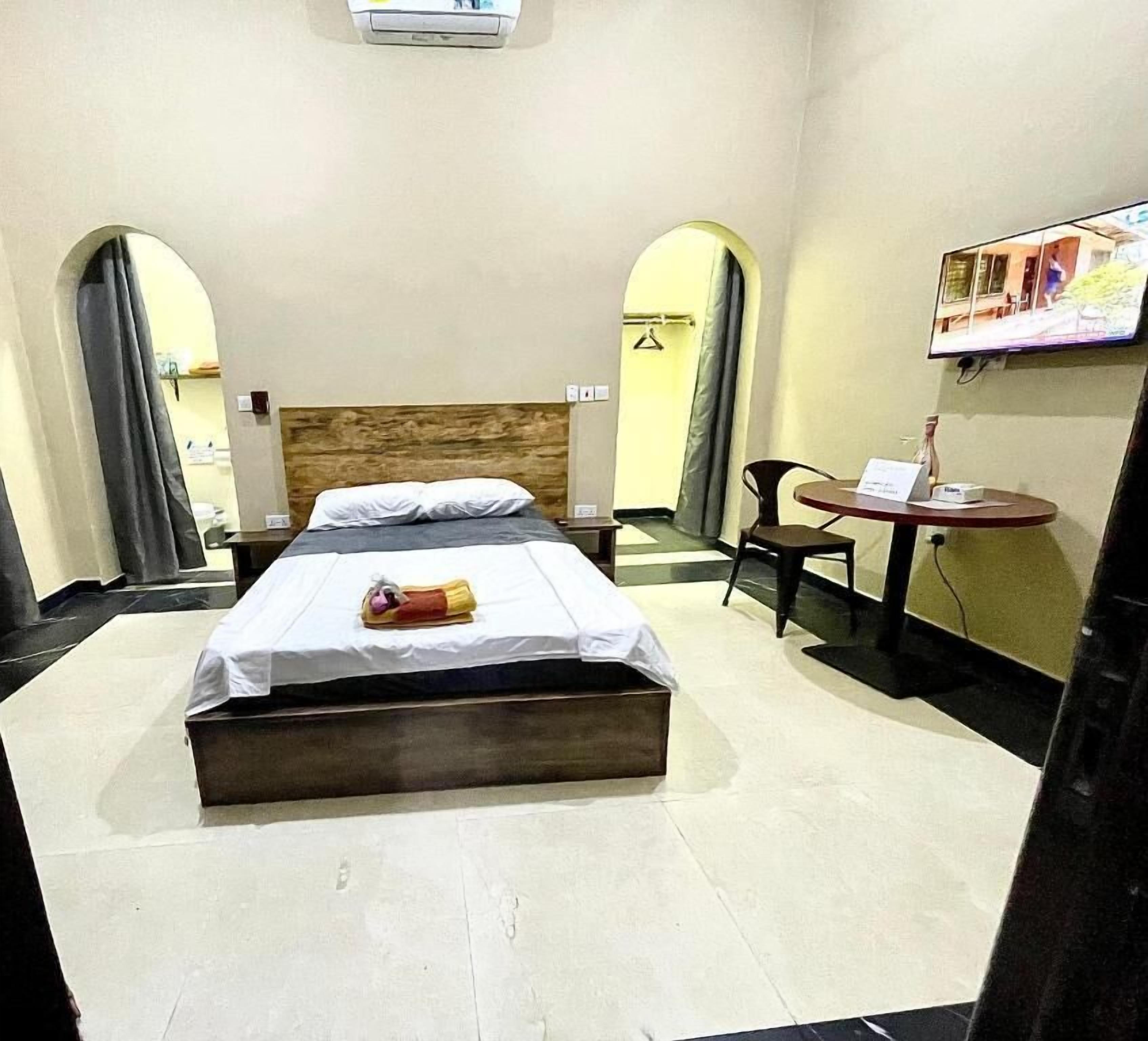 Premium bedding, desk, laptop workspace, blackout curtains