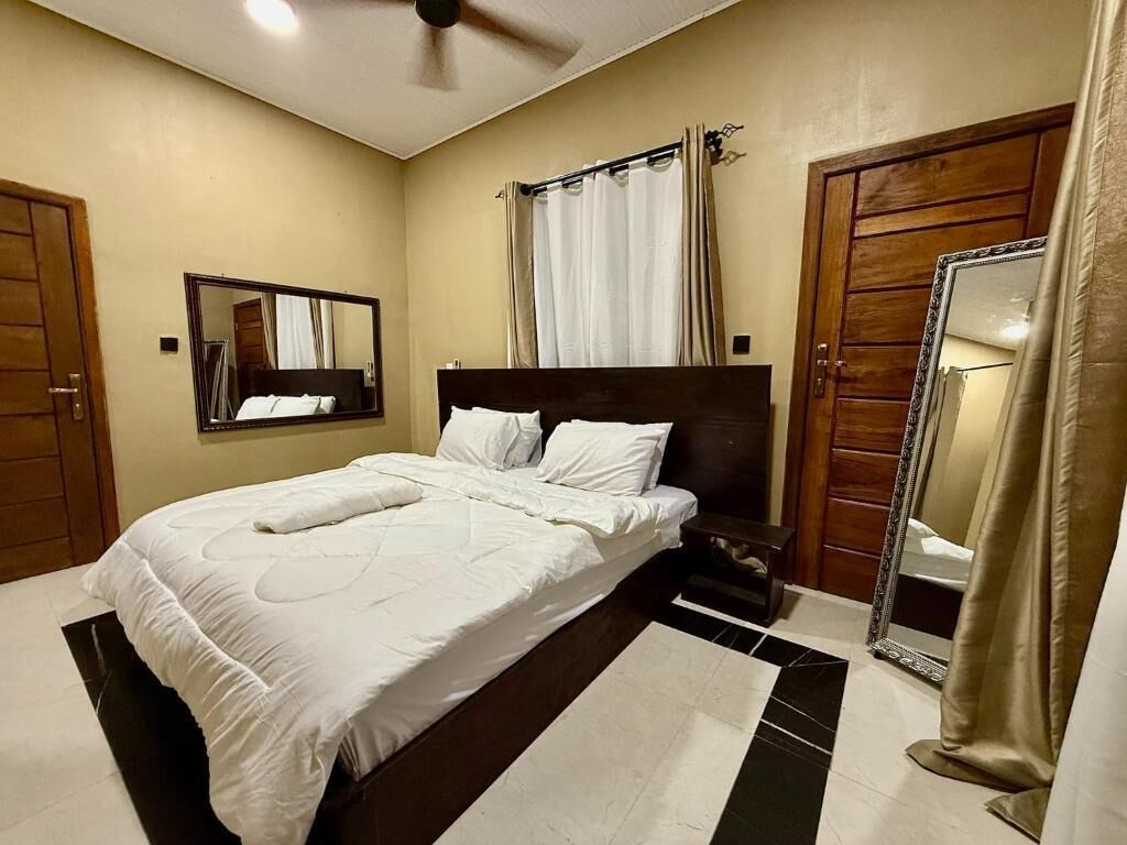 Premium bedding, desk, laptop workspace, blackout curtains