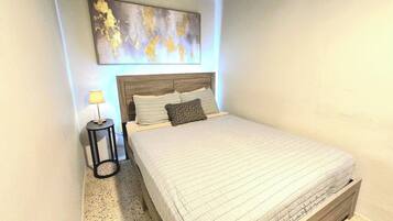 Iron/ironing board, travel crib, bed sheets