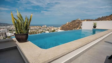 Outdoor pool, pool umbrellas, sun loungers