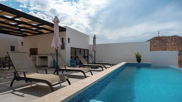 Outdoor pool, pool umbrellas, sun loungers
