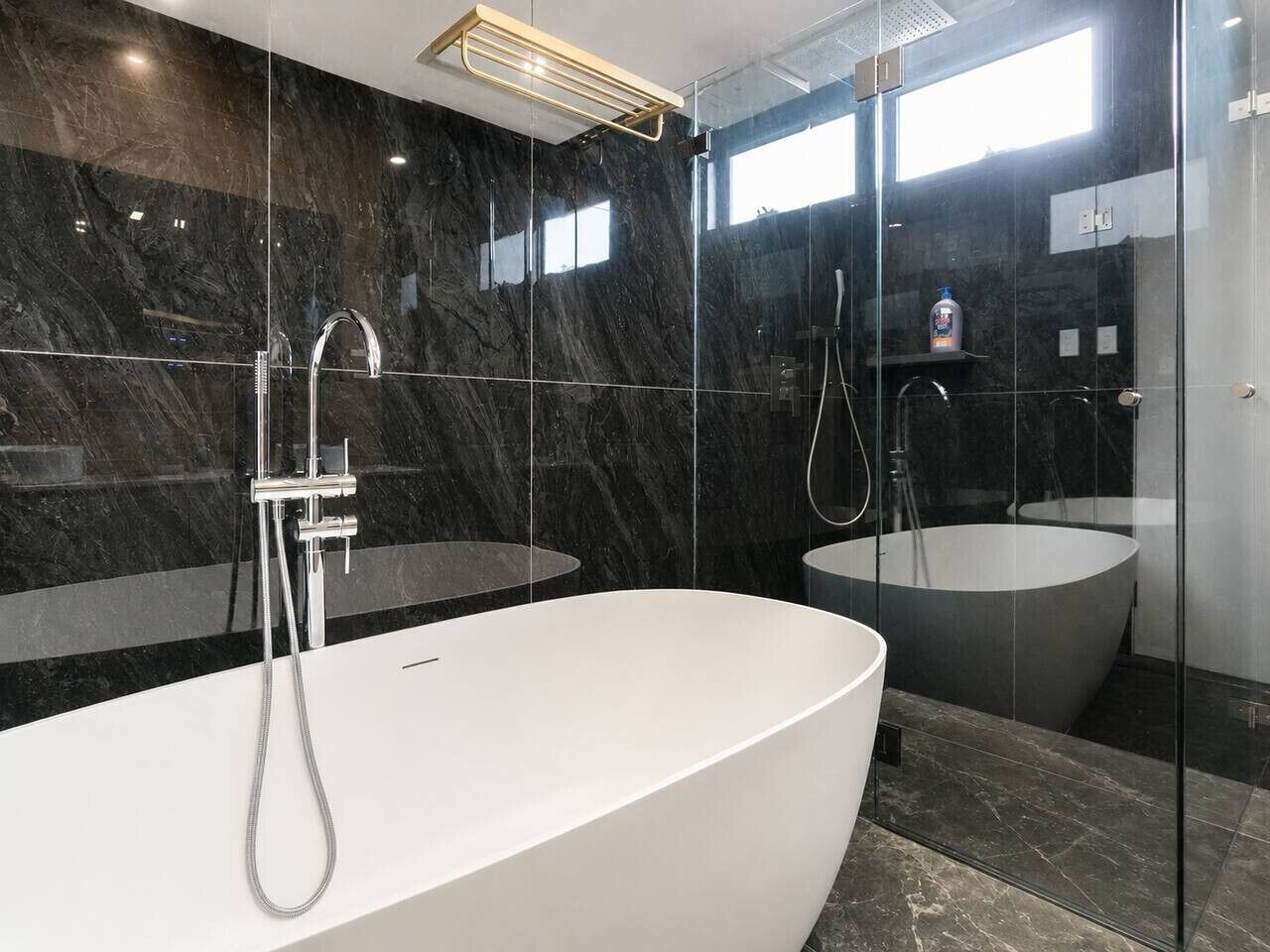 Shower, hair dryer, towels, shampoo