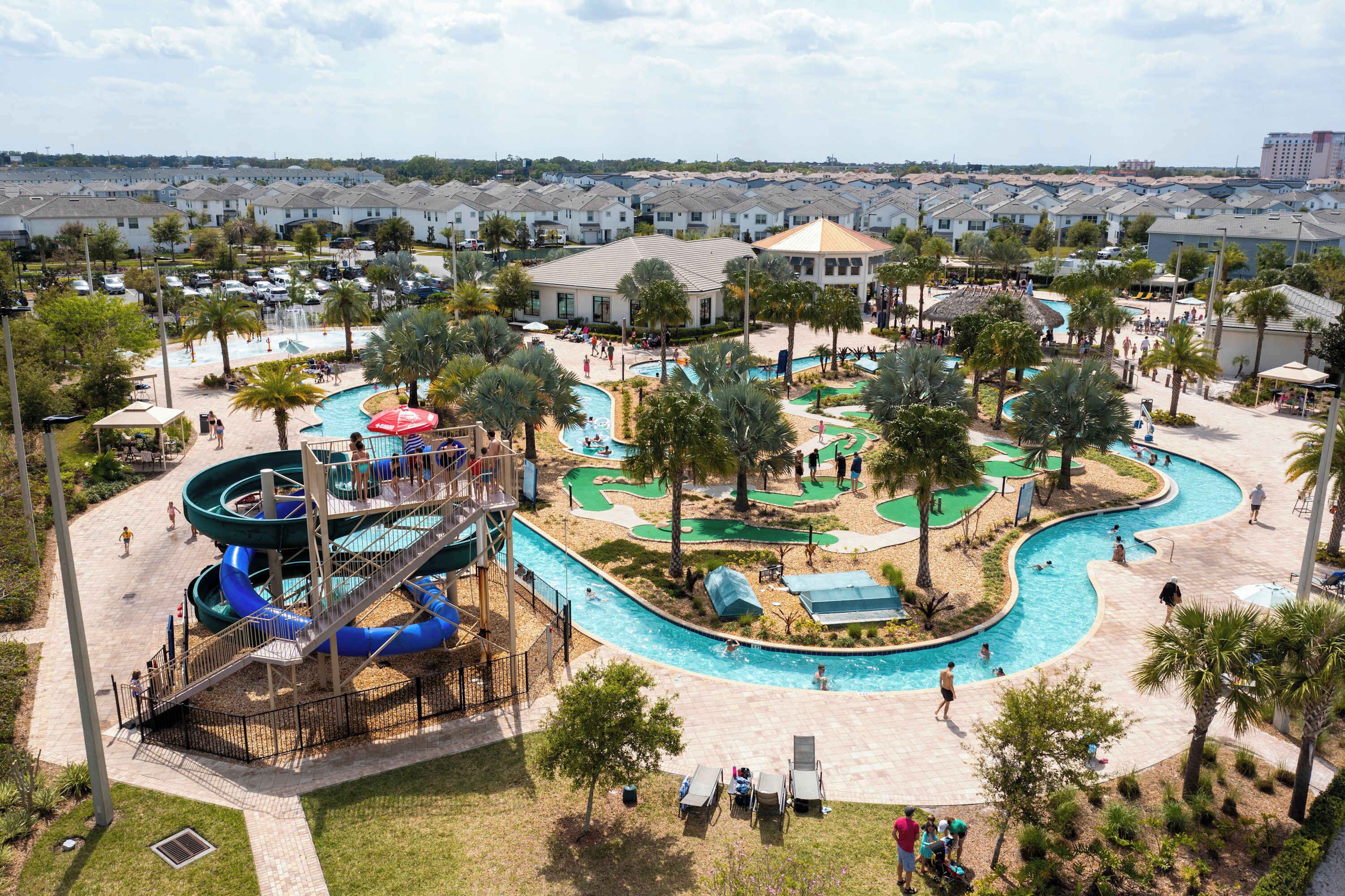 A water park with multiple pools, slides, and a play area.