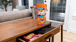 A wooden table with a can of Jenga and a drawer containing UNO cards. - Modern, luxe HTX Retreat| 8 Min to Toyota/Med Ctr (Houston)