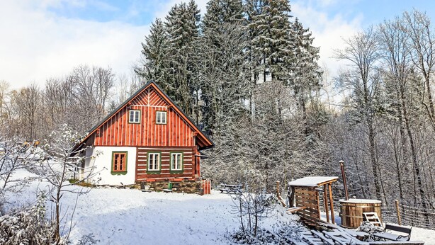 A wooden cabin with a sloped roof, surrounded by snow-covered trees and a clear sky. - U Kazíků by Interhome (Vysoké nad Jizerou)