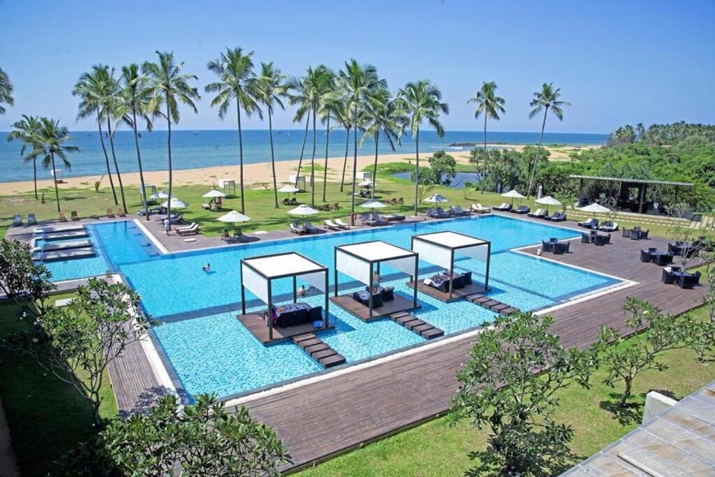 Outdoor pool, open 8:00 AM to 8:00 PM, pool umbrellas, sun loungers