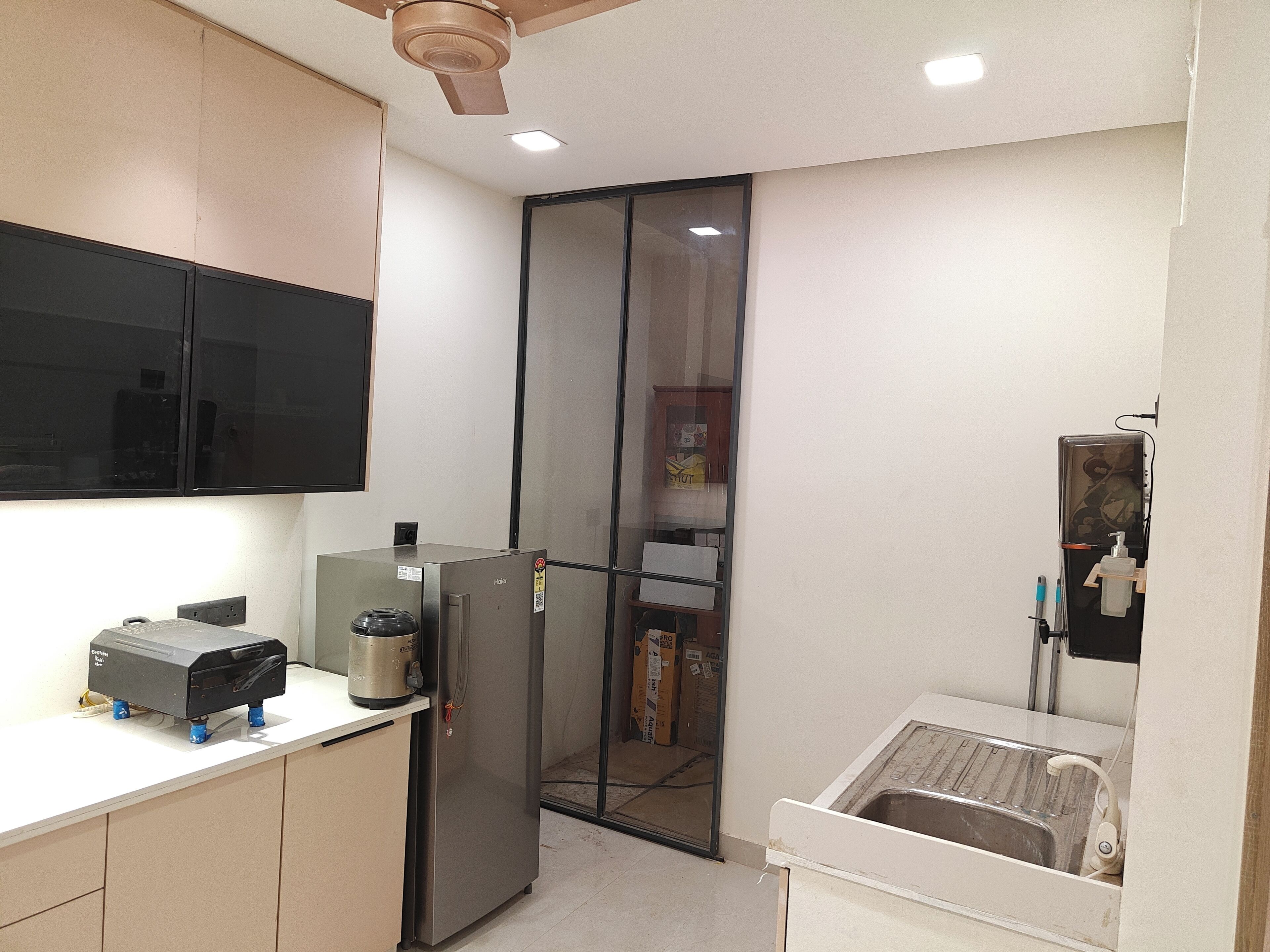 Fridge, stovetop, electric kettle, cookware/dishes/utensils