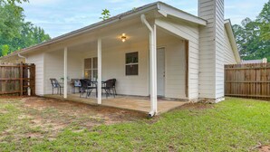 A single-story house with a covered patio area, a chimney, and a fenced yard. - Dual-Unit Group Getaway, 6 Mi to Atlanta Airport! (Atlanta)