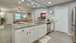 A modern kitchen with white cabinetry, granite countertops, and stainless steel appliances. - Dual-Unit Group Getaway, 6 Mi to Atlanta Airport! (Atlanta)