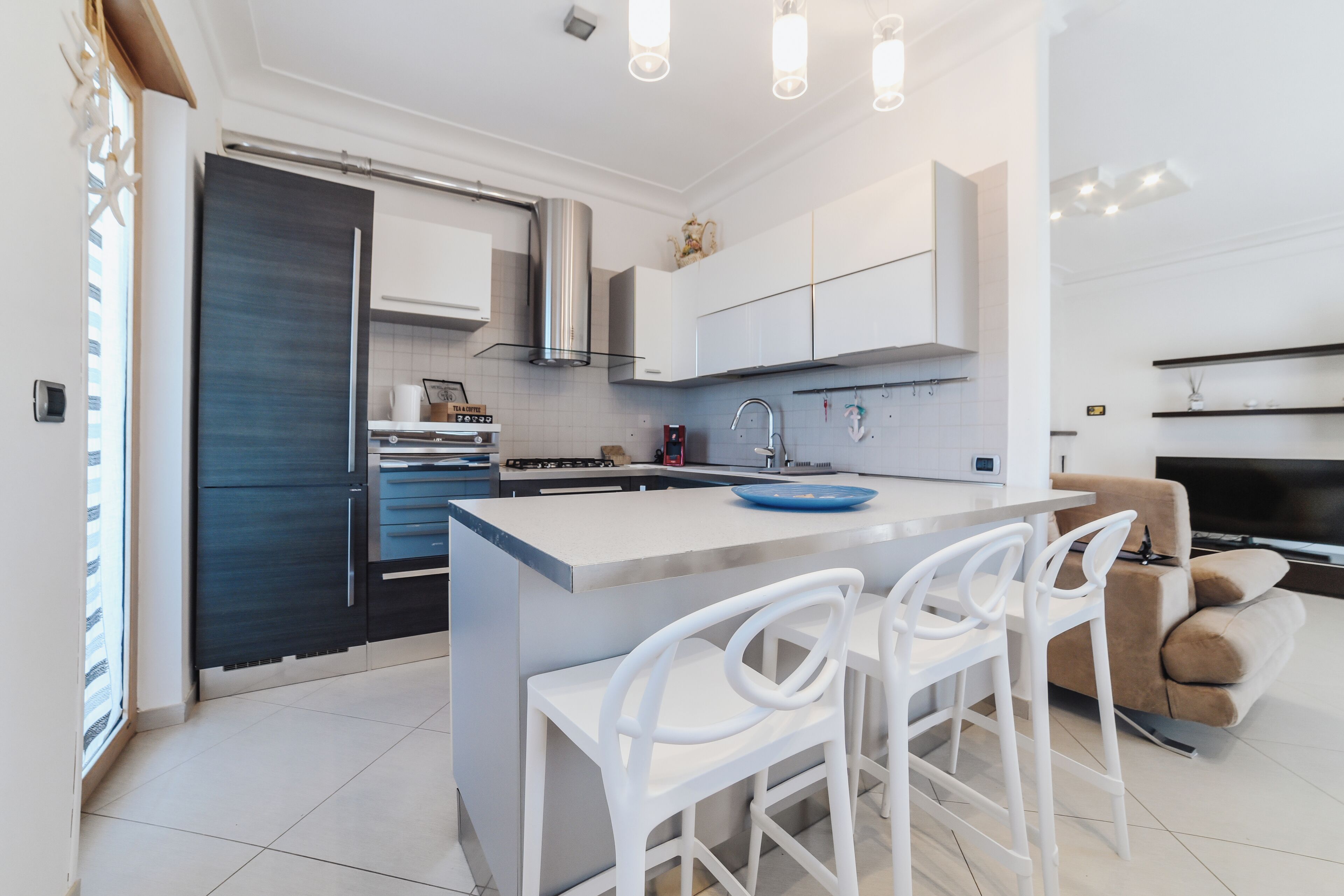 Appartement Deluxe | Cuisine privée | Réfrigérateur, four à micro-ondes, un four, surface de cuisson