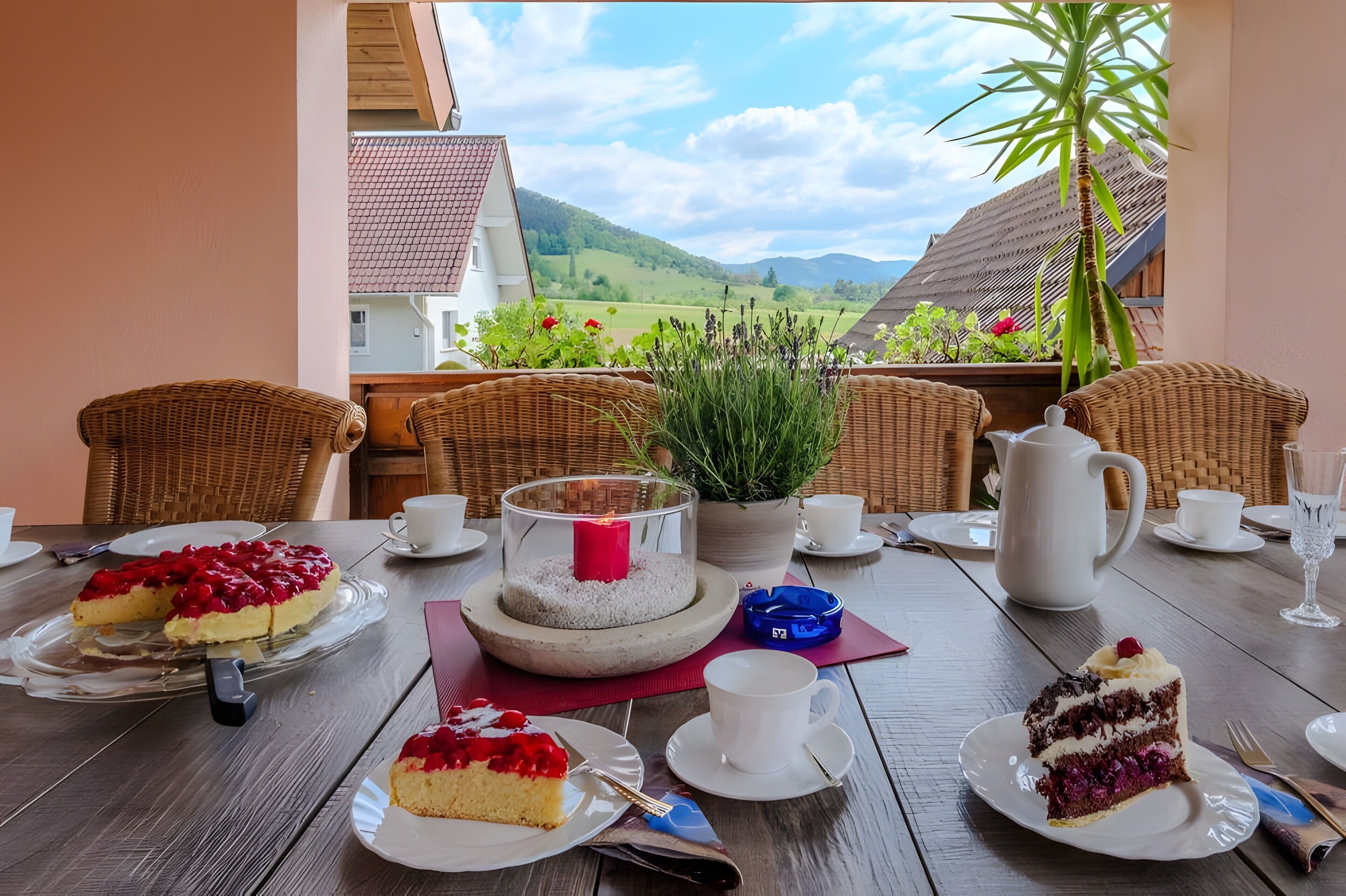 Ein Tisch, gedeckt für eine Mahlzeit, mit Blick auf die Landschaft.
