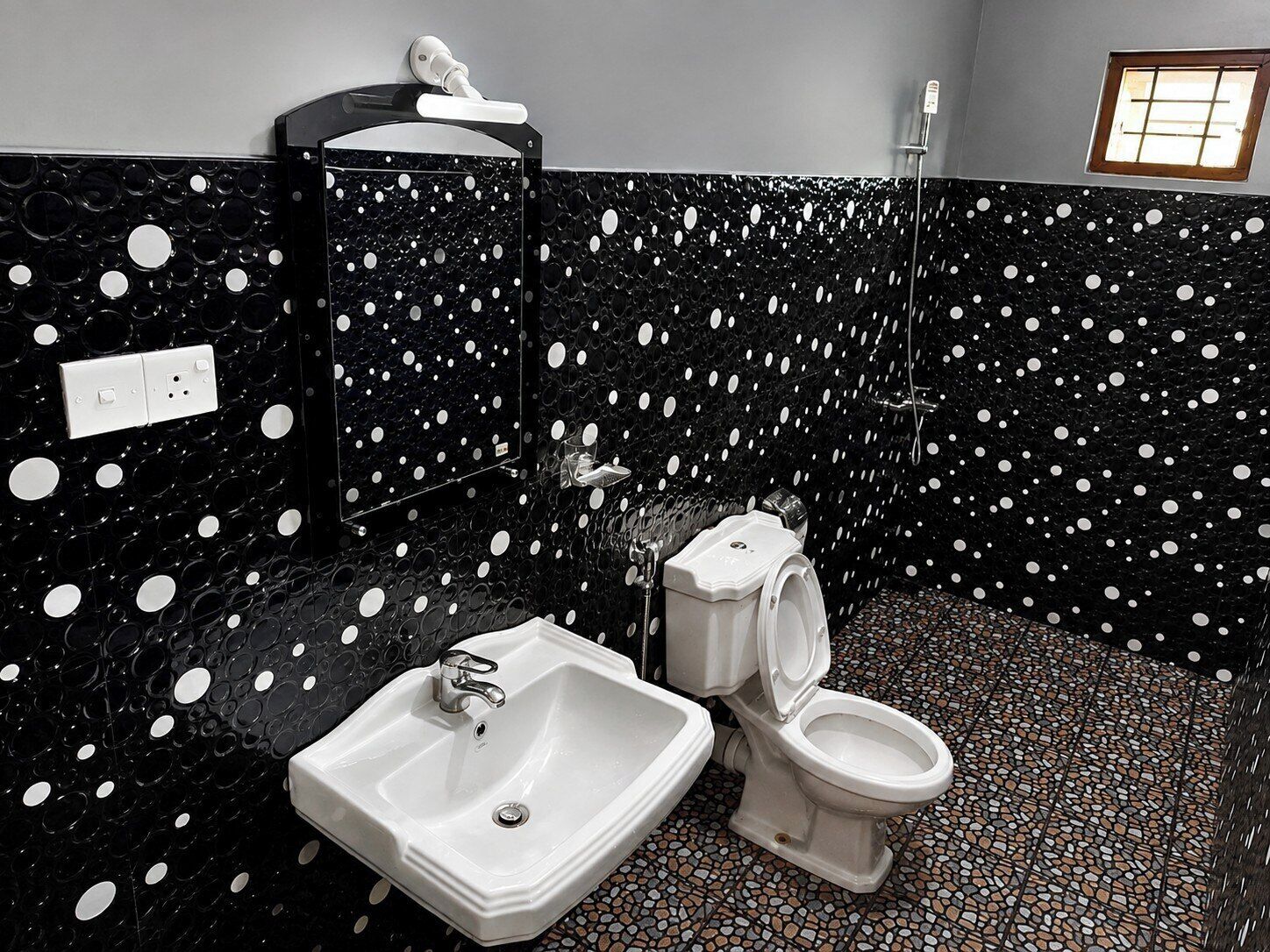 Shower, hair dryer, towels, toilet paper