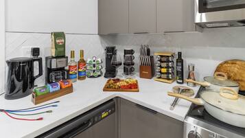 Coffee/tea maker, fridge, microwave, oven