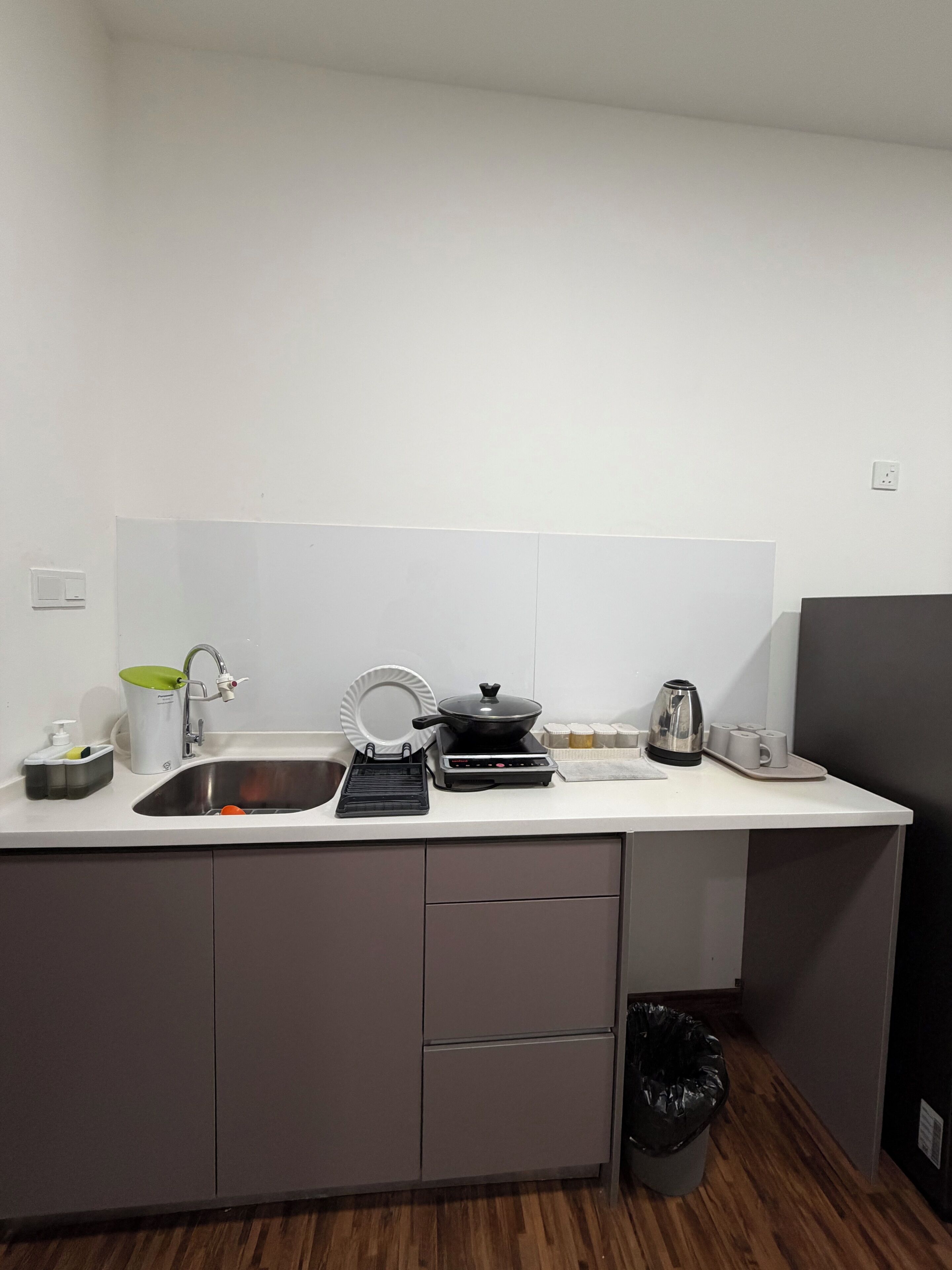 Fridge, electric kettle, cookware/dishes/utensils, dining table