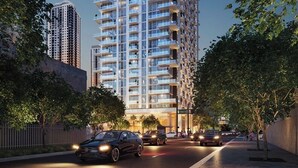 A high-rise building with multiple balconies, surrounded by trees and a street with cars. - Modern 1BR with Pool Near Brickell & Downtown Miami (Miami)