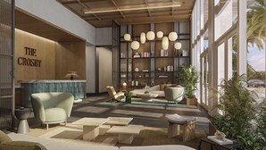 A modern interior with a reception desk, seating area, and large windows. - Modern 1BR with Pool Near Brickell & Downtown Miami (Miami)