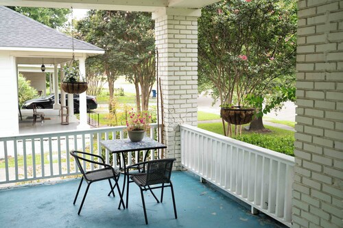 Porch swing, 1920s home, walk to live music